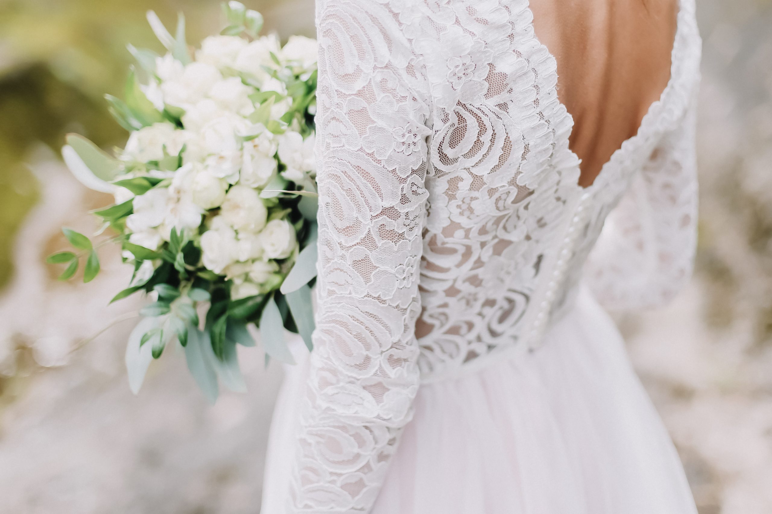 Bride,Holds,A,Wedding,Bouquet,,Wedding,Dress,,Wedding,Details